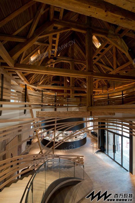 Wooden-strips-coil-around-staircase-at-Strasbourg-hotel-by-Jouin-Manku_dezeen_5.jpg